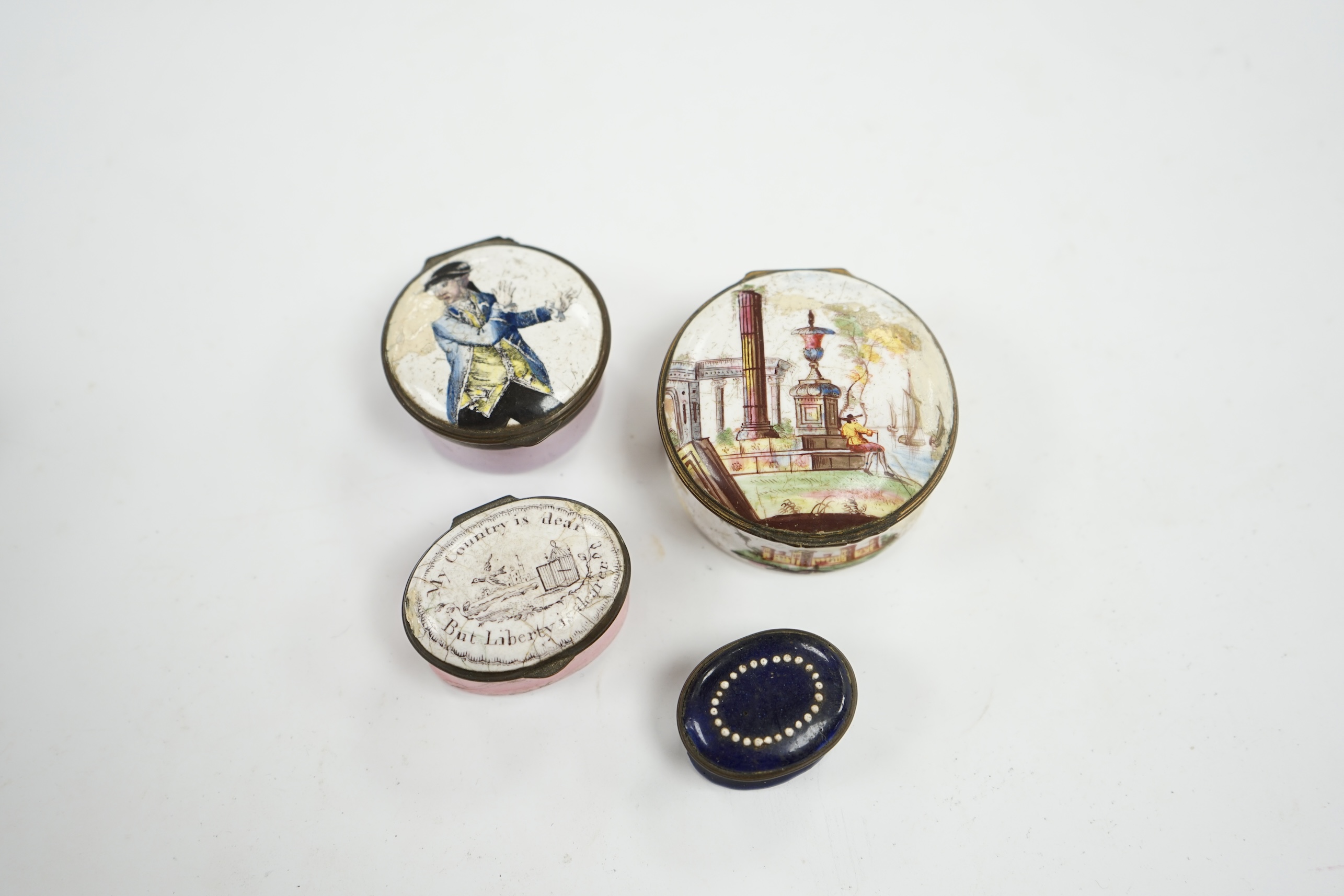 Four 18th century South Staffordshire enamel patch boxes, largest 5.5cm at base. Condition - poor, all have damage